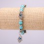 Bransoletka-amulet z turkusem z niebieskimi „oczami” na gumce, średnica 12 mm (±), długość 18 cm, z wstawkami i zawieszką