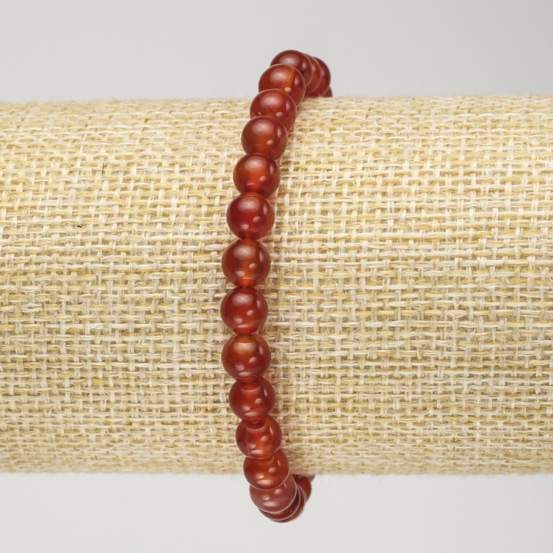 Bransoletka z karneolu na elastycznej gumce, gładkie kuleczki, średnica 6 mm, obwód 18 cm