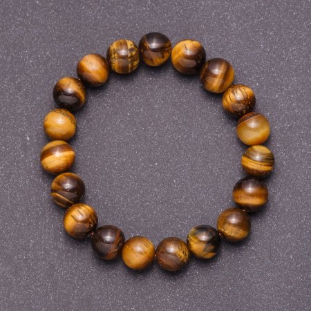 Bransoletka z naturalnego kamienia – tygrysie oko na elastycznej gumce, średnica 10 mm, obwód 18 cm