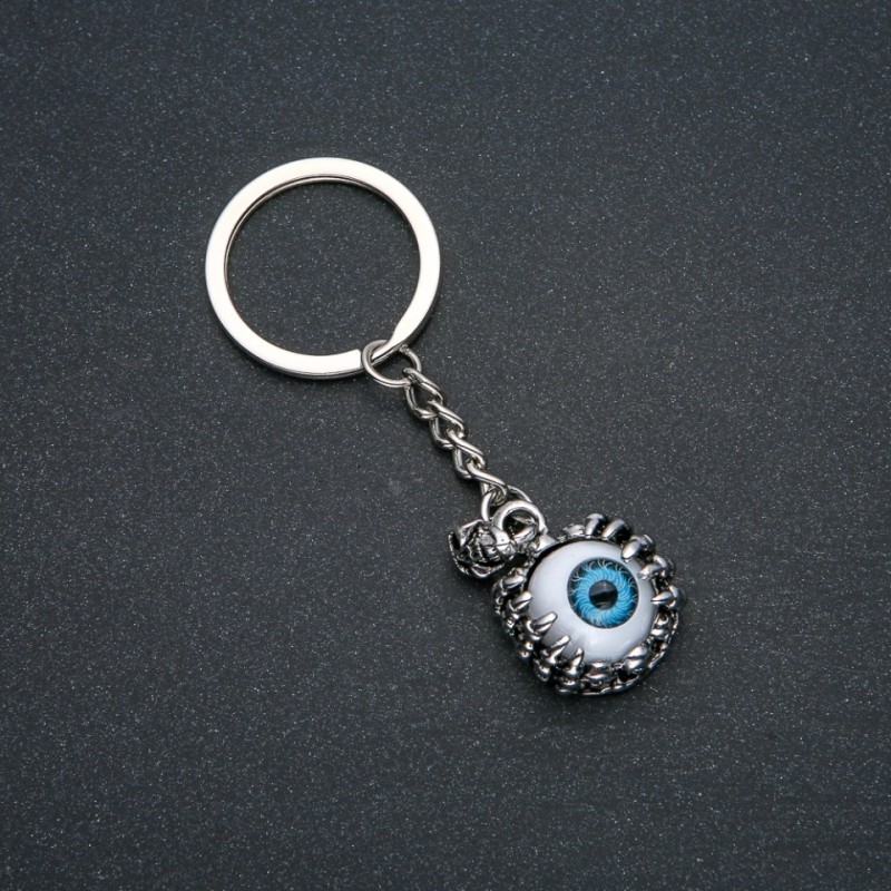 Brelok „Oko”, średnica 21 mm, długość 9 cm + - srebrzysty metal