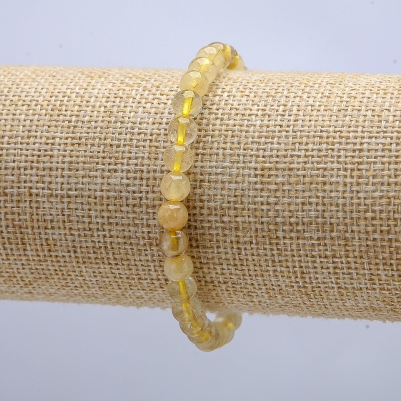 Bransoletka na gumce z kwarcu rutylowego, gładka kula, średnica 6 mm ± obwód 18 cm +