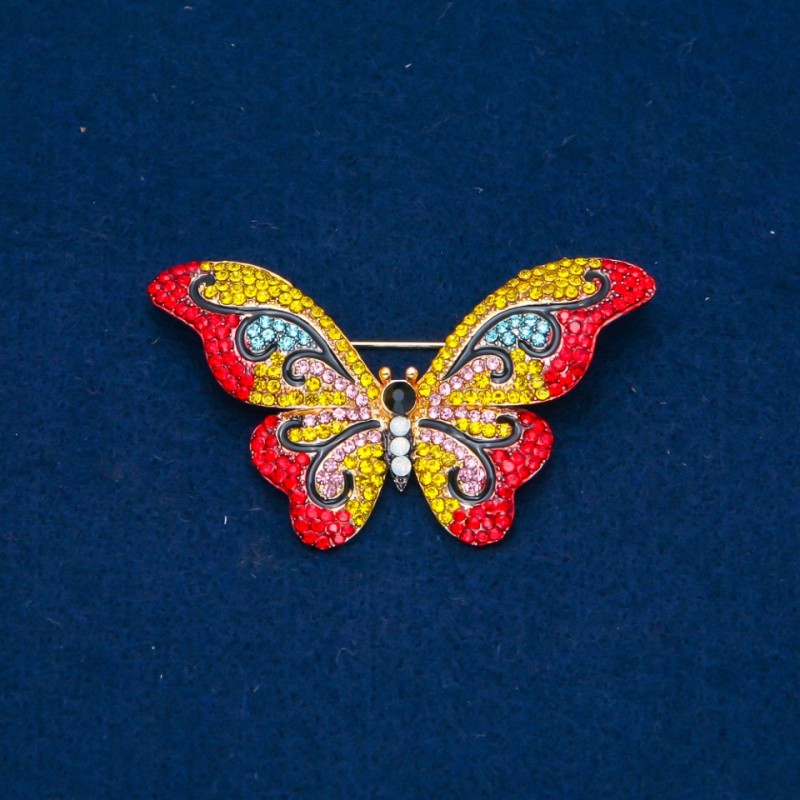 Broszka Motyl z kolorowymi kryształkami, metal złocony 35×58 mm +