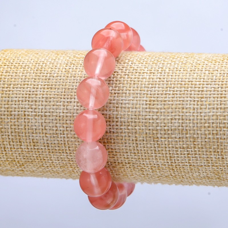 Bransoletka na gumce z chalcedonem sztucznym, gładka kuleczka, średnica około 12 mm, długość 18 cm+