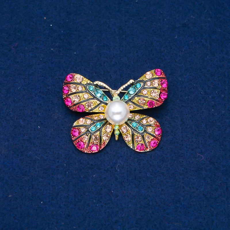 Broszka Motyl z złocistym metalem, różnobarwne kryształy i koralik 33×42 mm +