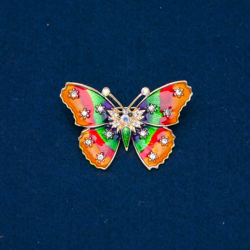 Broszka motyl złocisty metal, emalia i białe kryształki w odcieniu benzynowym 30×44 mm +
