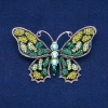 Wyprzedaż! Broszka „Motyl” ze srebrzystego metalu, zielonych, limonkowych i benzynowych kryształów 48×71 mm +