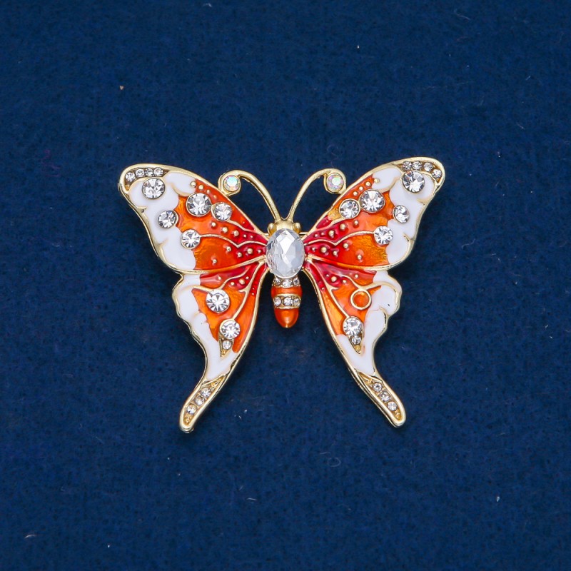 broszka motyl z metalem w kolorze złotym, emalią i białymi cyrkoniami 43×52 mm +