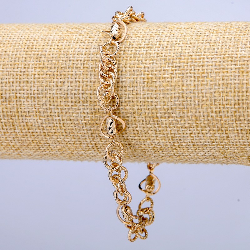 Bransoletka Xuping pozłacana 18K, grubość ok. 7 mm, długość 19–22 cm.