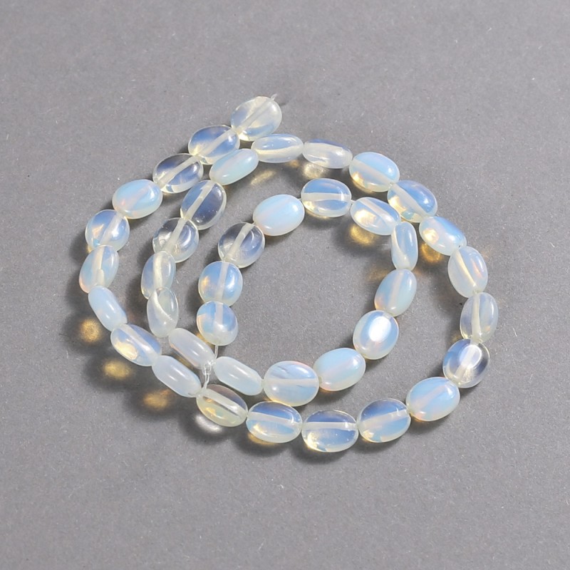 Koraliki na nici z kamienia księżycowego syntetycznego, owalne 10×8 mm