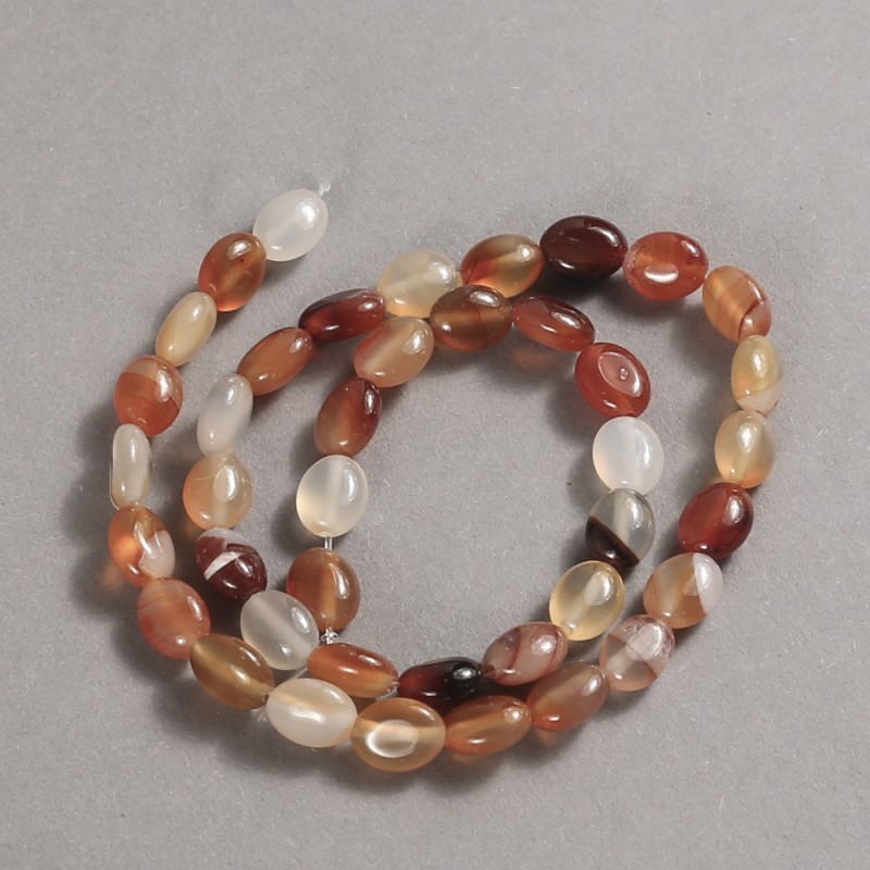 Koraliki na nici z naturalnego kamienia karneol gładki owal, średnica 10x8 mm, długość 39 cm