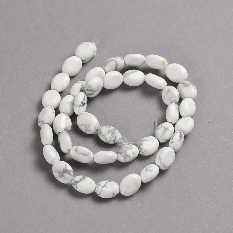 Koraliki na nitce z naturalnego kamienia kaholonu, gładkie owalne, średnica 10×8 mm ±, długość 39 cm ±