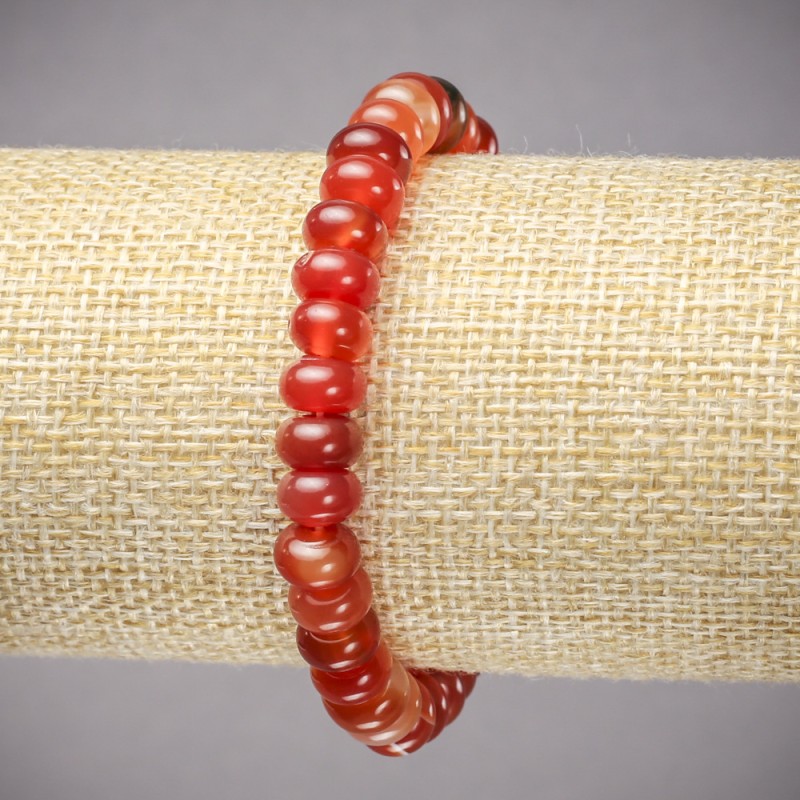 Bransoletka na gumce z naturalnego karneolu, gładkie rondelki, wymiary 8×5 mm, długość 18 cm