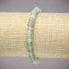 Bransoletka na gumce z naturalnego jadeitu — gładkie koraliki w kształcie rondeli, średnica 6×4 mm, długość 18 cm