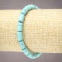 Bransoletka na gumce z turkusem, w formie gładkich cylindrów, średnica 10×6 mm+