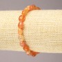 Bransoletka na gumce z naturalnego karneolu, fasetowane koraliki, średnica 9×7 mm+