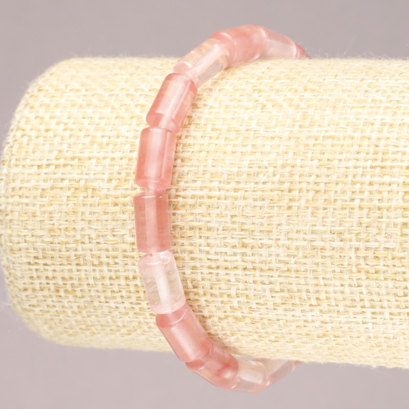 Bransoletka na gumce z naturalnego chalcedonu, gładkie cylindryczne koraliki, średnica 10 × 6 mm