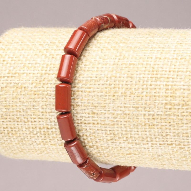 Bransoletka na gumce z naturalnego kamienia jaspis czerwony, gładkie cylindryczne koraliki, średnica 10×6 mm