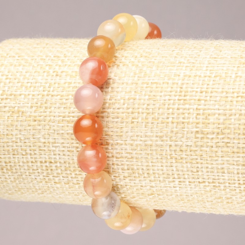 Bransoletka na gumce z naturalnego agatu pomarańczowego, gładka kulka, średnica 8,5 mm