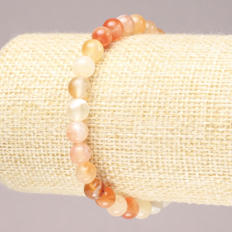 Bransoletka na gumce z naturalnego agatu pomarańczowy, gładka kulka, średnica 6,5 mm+