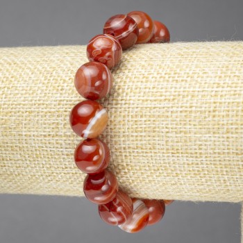 Bransoletka na elastycznej gumce z naturalnym pomarańczowym agatem oczkowym, gładkimi kulkami o średnicy 12 mm+