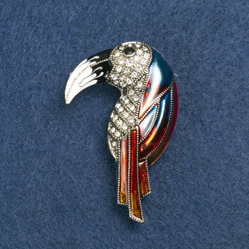 Broszka Tukana z złotego metalu, emalii i kryształów 36×16 mm +