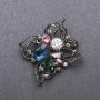 Broszka «Order piękności» z niebieskim kryształem 51×48 mm czarny metal