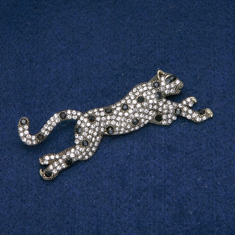Broszka Lampart z białymi i czarnymi kryształami, metal srebrzysty 78×30 mm +