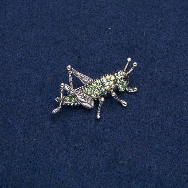 Broszka Konik polny z metalem srebrzystym i czarnymi, zielonymi i benzynowymi cyrkoniami, 44×27 mm +