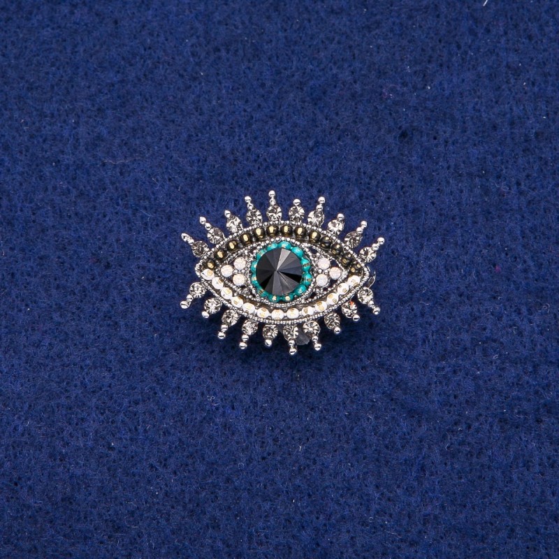 Broszka Oko w cyrkoniach, srebrzysty metal, 21×26 mm