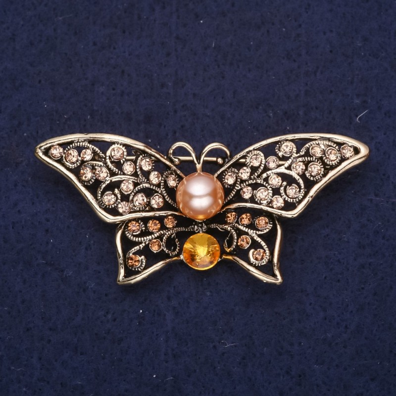 Broszka Motyl z żółtymi kamieniami i perłowym koralikiem, 55 × 25 mm, żółty metal