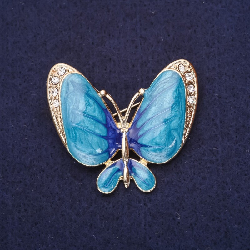 Broszka Motyl z białymi cyrkoniami i emalią w kolorze błękitnym, 36×42 mm, metal żółty