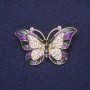 Broszka Motyl fioletowa emalia białe kryształy 45×28 mm żółty metal