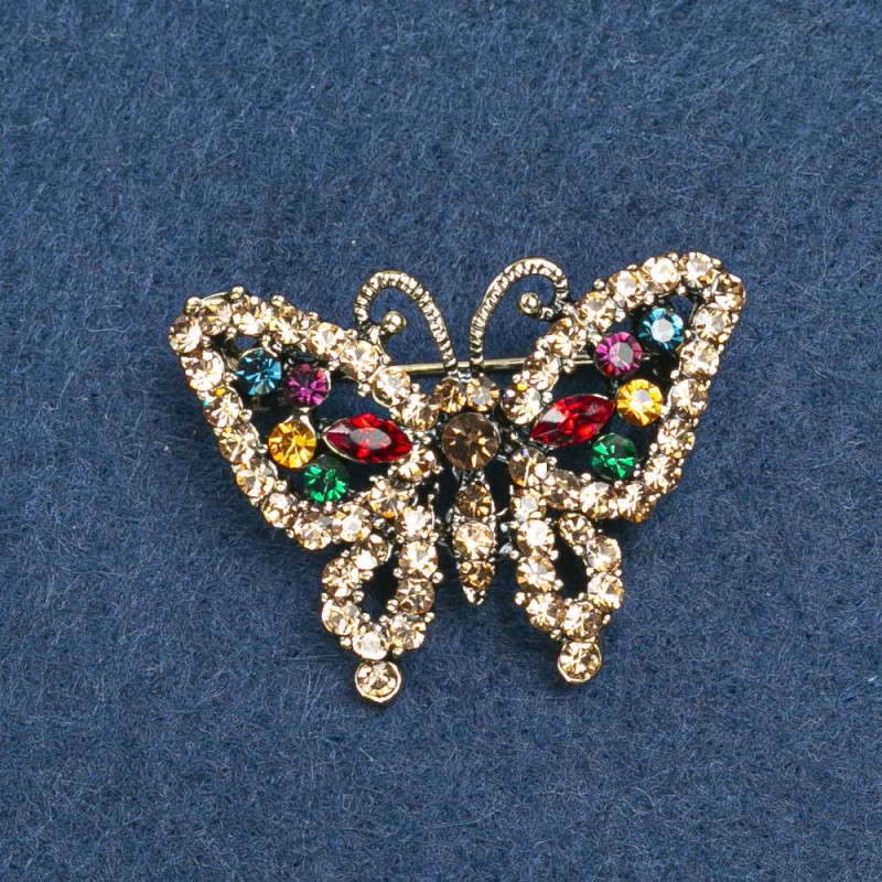 Broszka «Motyl» złocisty z kryształkami 36 × 28 mm +