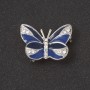 Broszka Motyl – niebieska emalia, białe kryształy, kolor metalu „srebro”, 2,7 cm