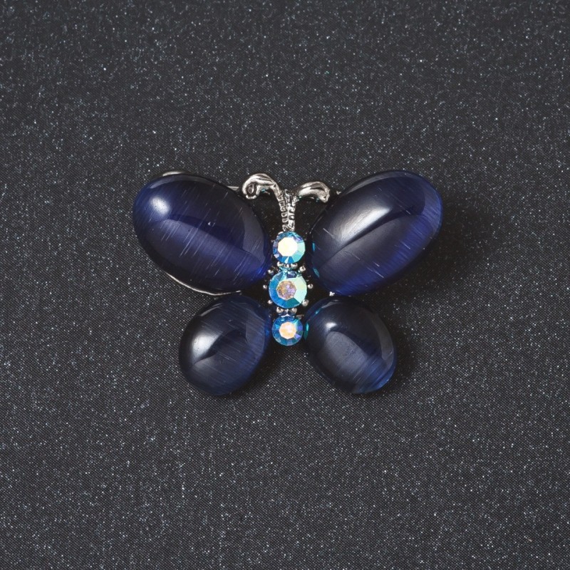 Broszka „Motyl” z niebieskim kamieniem Kocie oko, kolor metalu „srebro”, 2 cm