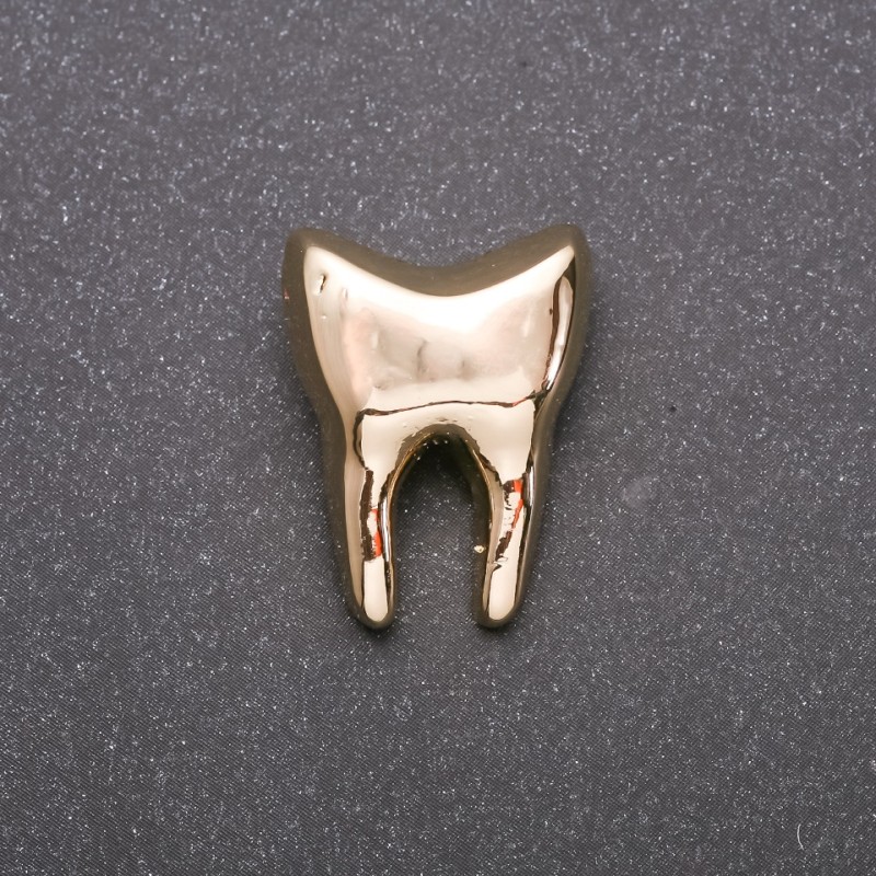 Broszka Złoty ząb z żółtego metalu 17×23 mm