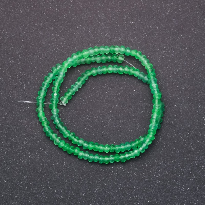 Koraliki tonowanego sztucznego kamienia «Chryzolit» fasetowane w kształcie rondelka, średnica 4×2 mm, na nici, długość 38 cm