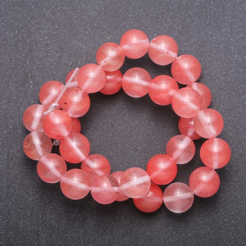 Koraliki z naturalnego kamienia - różowy chalcedon na nici, gładka kulka, średnica 12 mm (+/-), długość 37 cm