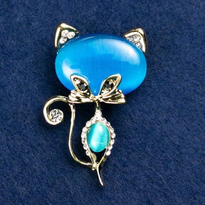 Broszka «Kotek kocie oko» kolor niebieski z białymi kryształkami 45×28 mm żółty metal