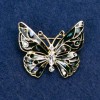 Broszka „Motyl” z białymi cyrkoniami, ciemnoszarej emalii z haliozytu, złoty kolor metalu 37×32 mm