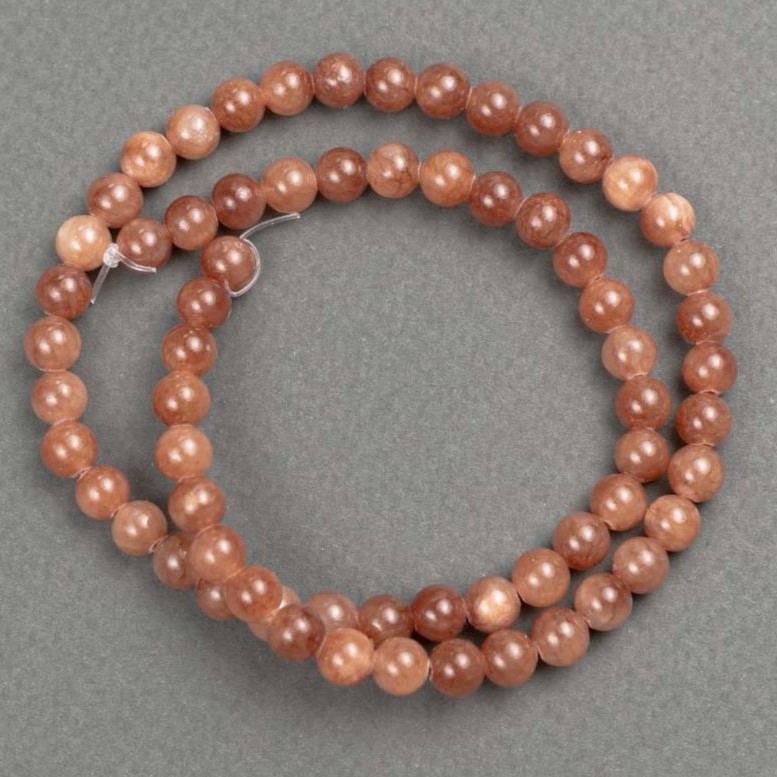 Koraliki Selenitowe (akryl sztuczny) na nici, gładkie kulki, średnica 6,5 mm, długość 40 cm