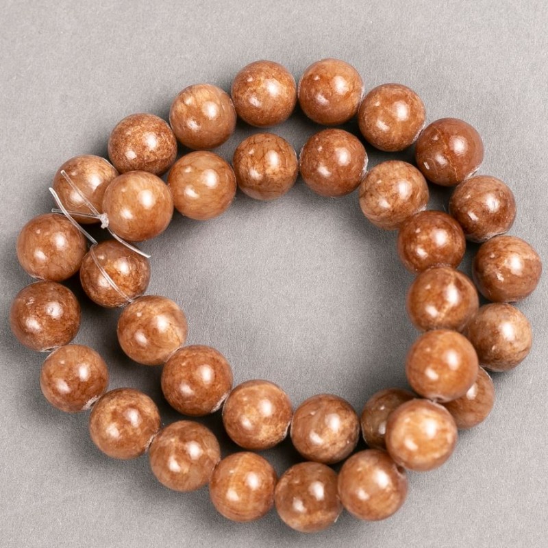 Koraliki Selenit (akryl sztuczny) na nici, gładkie kuleczki, średnica ok. 12,5 mm, długość 40 cm.