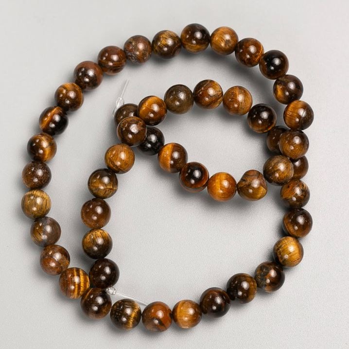 Koraliki na żyłce z naturalnego kamienia tygrysie oko, średnica 8 mm, długość 37 cm