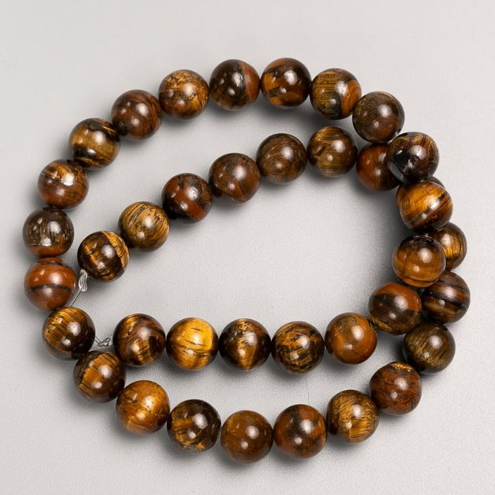 Koraliki na nitce z naturalnego kamienia Tygrysie oko, średnica 10 mm +/-, długość 38 cm +/-