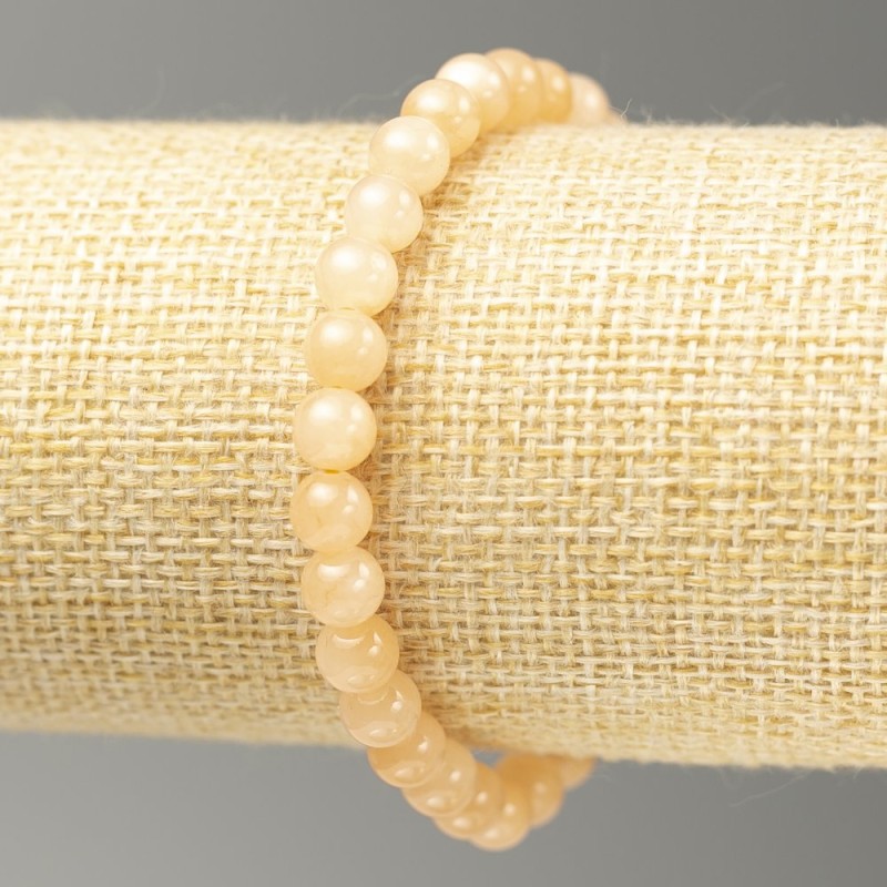 Bransoletka na gumce z akrylowego selenitu, gładkie kuleczki, średnica 6,5 mm, długość 18 cm