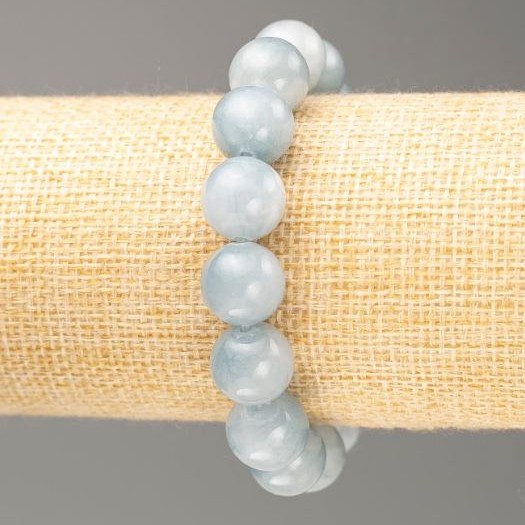 Bransoletka na gumce akwamaryn (sztuczny akryl) gładka kulka, średnica ok. 12,5 mm, długość 18 cm