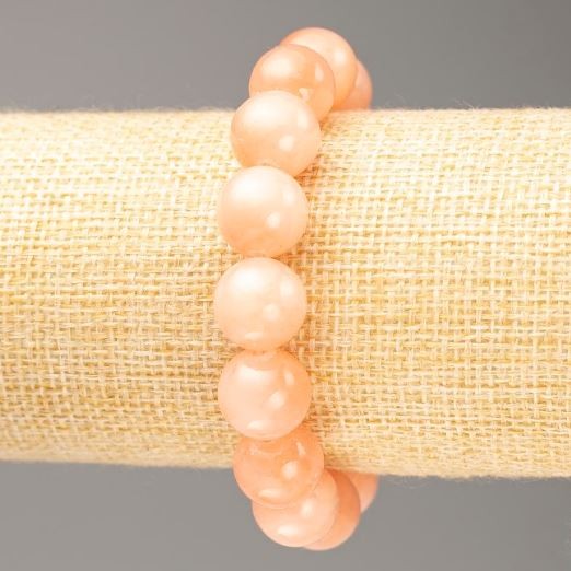 Bransoletka na gumce z akrylu imitującego selenit, gładka kulka, średnica 12,5 mm, długość 18 cm