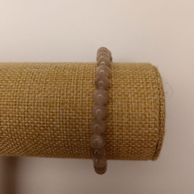 Bransoletka na gumce z tonowanego kwarcu (akryl sztuczny), szare gładkie kulki, średnica 6,5 mm, długość 18 cm