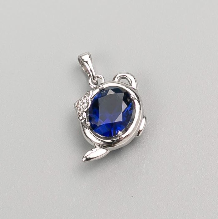 Wisiorek Xuping z niebieskim kamieniem 20×14 mm, rhodiowany