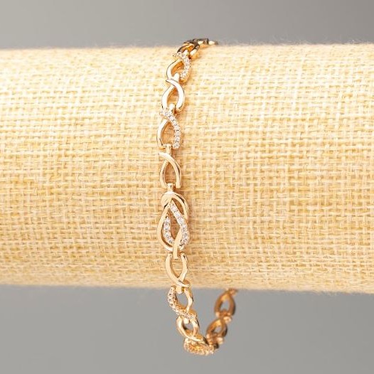 Bransoleta Xuping pozłacanie 18K, długość 19 cm, grubość 5 mm ± z białymi cyrkoniami